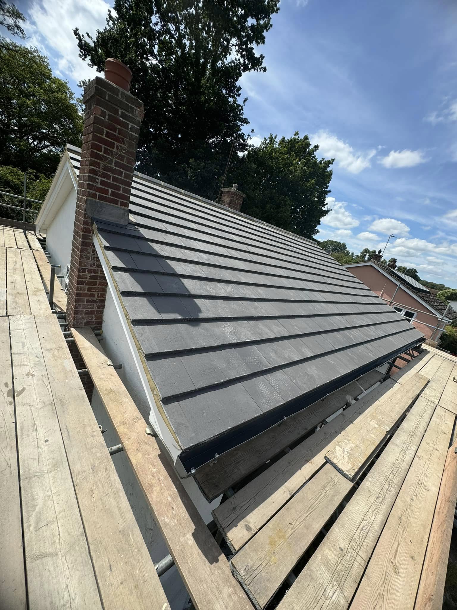 Completed slate roof by Nolan and Nunn Roofing
